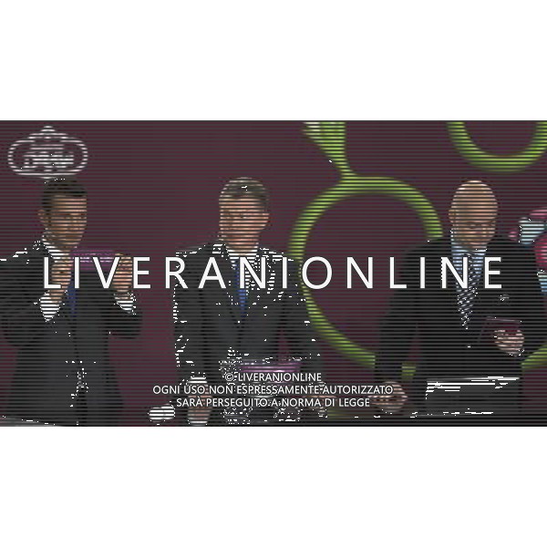 Ukrainian football star Andriy Shevchenko (L) draw Faroe Islands next the former Ukrainian soccer player Oleg Blokhin (C) with UEFA general secretary Gianni Infantino (R) durnig the UEFA EURO 2012 qualifying Draw Cremony in the Congress Hall of the Palace of Culture and Science in Warsaw, Poland, 7 February 2010. 51 teams taking part in the Euro 2012 qualifications will create nine groups. Six of them will consist of six teams, and three of them – five. Winners and one team from the second place with the best achievements will advance to championships directly. The other eight teams classified on the second position in the group will set up four pairs. The EURO 2012 European soccer championship will kick off June 2012 in Poland and Ukraine. The opening match at the National Stadium in Warsaw will take place on 8 June. Eliminations will begin in September 2010 and will last until autumn 2011. /Agenzia Aldo Liverani Sas - ITALY ONLY - VARSAVIA: SORTEGGI DI QUALIFICAZIONE AGLI EUROPEI DI CALCIO UCRAINA-POLONIA 2012