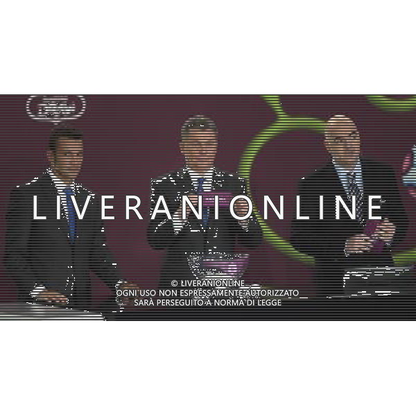 Ukrainian former football star Oleg Bloghin (C) draws Andorra next the Ukrainian soccer player Andriy Shevchenko (L) with UEFA general secretary Gianni Infantino (R) durnig the UEFA EURO 2012 qualifying Draw Cremony in the Congress Hall of the Palace of Culture and Science in Warsaw, Poland, 7 February 2010. 51 teams taking part in the Euro 2012 qualifications will create nine groups. Six of them will consist of six teams, and three of them – five. Winners and one team from the second place with the best achievements will advance to championships directly. The other eight teams classified on the second position in the group will set up four pairs. The EURO 2012 European soccer championship will kick off June 2012 in Poland and Ukraine. The opening match at the National Stadium in Warsaw will take place on 8 June. Eliminations will begin in September 2010 and will last until autumn 2011. /Agenzia Aldo Liverani Sas - ITALY ONLY - VARSAVIA: SORTEGGI DI QUALIFICAZIONE AGLI EUROPEI DI CALCIO UCRAINA-POLONIA 2012