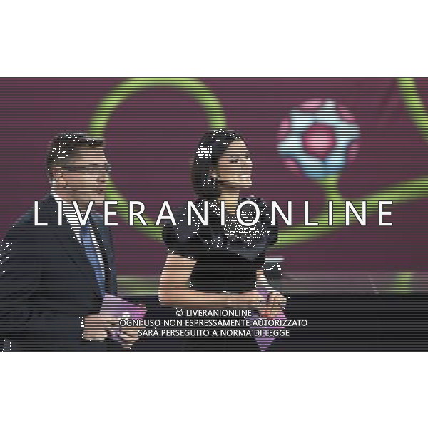 Piotr Sobczyñski (L), a sports presenter and commentator with Polish public broadcaster TVP, and Masha Yefrosinina (R), the Ukrainian actress and television presenter lead through the UEFA EURO 2012 qualifying Draw Cremony in the Congress Hall of the Palace of Culture and Science in Warsaw, Poland, 7 February 2010. 51 teams taking part in the Euro 2012 qualifications will create nine groups. Six of them will consist of six teams, and three of them – five. Winners and one team from the second place with the best achievements will advance to championships directly. The other eight teams classified on the second position in the group will set up four pairs. The EURO 2012 European soccer championship will kick off June 2012 in Poland and Ukraine. The opening match at the National Stadium in Warsaw will take place on 8 June. Eliminations will begin in September 2010 and will last until autumn 2011. /Agenzia Aldo Liverani Sas - ITALY ONLY - VARSAVIA: SORTEGGI DI QUALIFICAZIONE AGLI EUROPEI DI CALCIO UCRAINA-POLONIA 2012