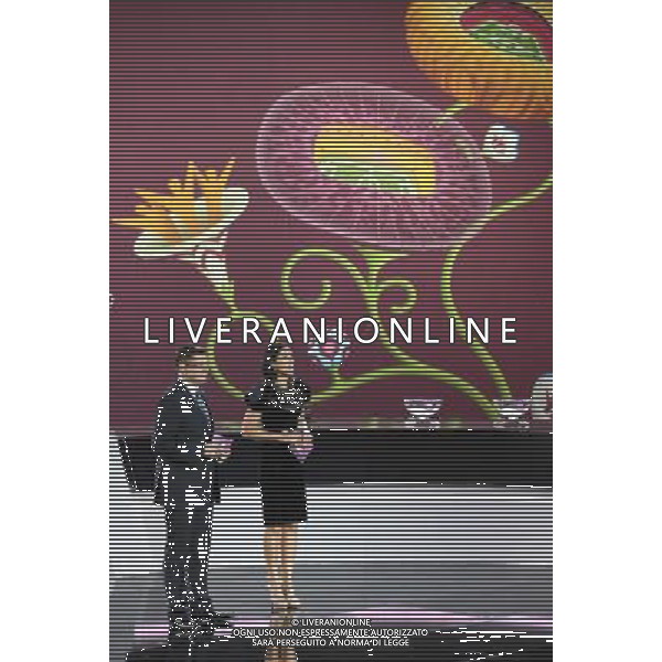 Piotr Sobczyñski (L), a sports presenter and commentator with Polish public broadcaster TVP, and Masha Yefrosinina (R), the Ukrainian actress and television presenter lead through the UEFA EURO 2012 qualifying Draw Cremony in the Congress Hall of the Palace of Culture and Science in Warsaw, Poland, 7 February 2010. 51 teams taking part in the Euro 2012 qualifications will create nine groups. Six of them will consist of six teams, and three of them – five. Winners and one team from the second place with the best achievements will advance to championships directly. The other eight teams classified on the second position in the group will set up four pairs. The EURO 2012 European soccer championship will kick off June 2012 in Poland and Ukraine. The opening match at the National Stadium in Warsaw will take place on 8 June. Eliminations will begin in September 2010 and will last until autumn 2011. /Agenzia Aldo Liverani Sas - ITALY ONLY - VARSAVIA: SORTEGGI DI QUALIFICAZIONE AGLI EUROPEI DI CALCIO UCRAINA-POLONIA 2012