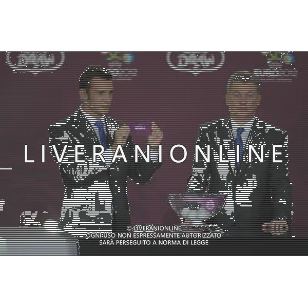 Ukrainian football star Andriy Shevchenko (L) draws Serbia next the former Ukrainian soccer player Oleg Blokhin durnig the UEFA EURO 2012 qualifying Draw Cremony in the Congress Hall of the Palace of Culture and Science in Warsaw, Poland, 7 February 2010. /Agenzia Aldo Liverani Sas - ITALY ONLY - VARSAVIA: SORTEGGI DI QUALIFICAZIONE AGLI EUROPEI DI CALCIO UCRAINA-POLONIA 2012