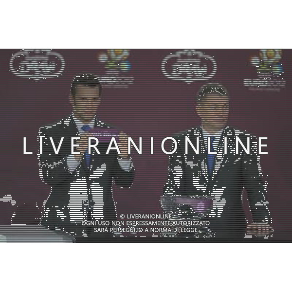 Ukrainian football star Andriy Shevchenko (L) draws Czech Republic next the former Ukrainian soccer player Oleg Blokhin durnig the UEFA EURO 2012 qualifying Draw Cremony in the Congress Hall of the Palace of Culture and Science in Warsaw, Poland, 7 February 2010. /Agenzia Aldo Liverani Sas - ITALY ONLY - VARSAVIA: SORTEGGI DI QUALIFICAZIONE AGLI EUROPEI DI CALCIO UCRAINA-POLONIA 2012