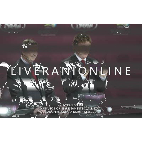 Polish former football star Zbigniew Boniek (R) draws Germany next Polish former football star Andrzej Szarmach (L) durnig the UEFA EURO 2012 qualifying Draw Cremony in the Congress Hall of the Palace of Culture and Science in Warsaw, Poland, 7 February 2010. /Agenzia Aldo Liverani Sas - ITALY ONLY - VARSAVIA: SORTEGGI DI QUALIFICAZIONE AGLI EUROPEI DI CALCIO UCRAINA-POLONIA 2012