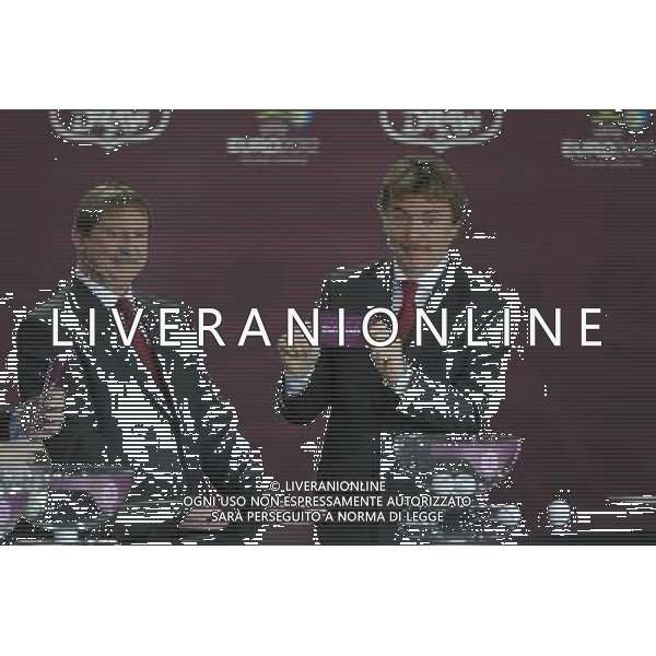 Polish former football star Zbigniew Boniek (R) draws England next Polish former football star Andrzej Szarmach (L) durnig the UEFA EURO 2012 qualifying Draw Cremony in the Congress Hall of the Palace of Culture and Science in Warsaw, Poland, 7 February 2010. /Agenzia Aldo Liverani Sas - ITALY ONLY - VARSAVIA: SORTEGGI DI QUALIFICAZIONE AGLI EUROPEI DI CALCIO UCRAINA-POLONIA 2012