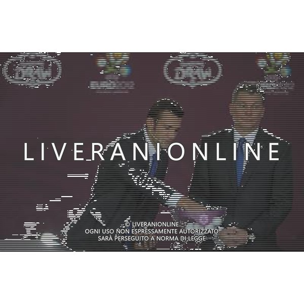 Ukrainian former football star Oleg Blokhin (R) removes the balls containing the names of country next the Ukrainian soccer player Andriy Shevchenko (L) durnig the UEFA EURO 2012 qualifying Draw Cremony in the Congress Hall of the Palace of Culture and Science in Warsaw, Poland, 7 February 2010. /Agenzia Aldo Liverani Sas - ITALY ONLY - VARSAVIA: SORTEGGI DI QUALIFICAZIONE AGLI EUROPEI DI CALCIO UCRAINA-POLONIA 2012