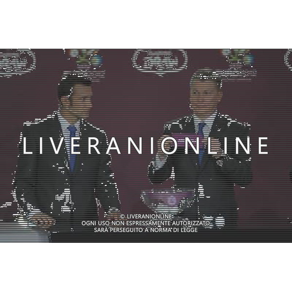 Ukrainian former football star Oleg Blokhin (R) draws Andorra next the Ukrainian soccer player Andriy Shevchenko (L) durnig the UEFA EURO 2012 qualifying Draw Cremony in the Congress Hall of the Palace of Culture and Science in Warsaw, Poland, 7 February 2010. /Agenzia Aldo Liverani Sas - ITALY ONLY - VARSAVIA: SORTEGGI DI QUALIFICAZIONE AGLI EUROPEI DI CALCIO UCRAINA-POLONIA 2012