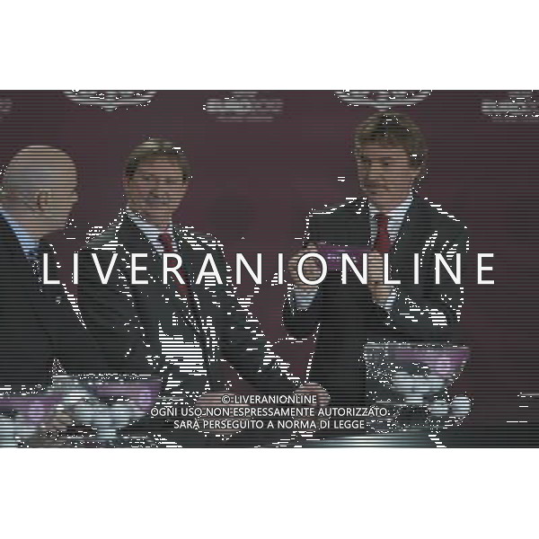 Polish former football star Zbigniew Boniek(R) draws Estonia next Polish former football star Andrzej Szarmach (L) and UEFA general secretary Gianni Infantino (L) durnig the UEFA EURO 2012 qualifying Draw Cremony in the Congress Hall of the Palace of Culture and Science in Warsaw, Poland, 7 February 2010. /Agenzia Aldo Liverani Sas - ITALY ONLY - VARSAVIA: SORTEGGI DI QUALIFICAZIONE AGLI EUROPEI DI CALCIO UCRAINA-POLONIA 2012