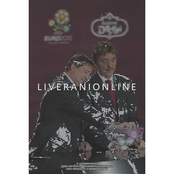 Polish former football star Andrzej Szarmach (L) removes the balls containing the names of country next Polish former football star Zbigniew Boniek (R) durnig the UEFA EURO 2012 qualifying Draw Cremony in the Congress Hall of the Palace of Culture and Science in Warsaw, Poland, 7 February 2010. /Agenzia Aldo Liverani Sas - ITALY ONLY - VARSAVIA: SORTEGGI DI QUALIFICAZIONE AGLI EUROPEI DI CALCIO UCRAINA-POLONIA 2012