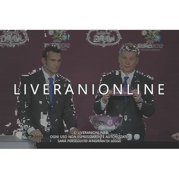 Ukrainian former football star Oleg Blokhin (R) draws Macedonia next the Ukrainian soccer player Andriy Shevchenko (L) durnig the UEFA EURO 2012 qualifying Draw Cremony in the Congress Hall of the Palace of Culture and Science in Warsaw, Poland, 7 February 2010. /Agenzia Aldo Liverani Sas - ITALY ONLY - VARSAVIA: SORTEGGI DI QUALIFICAZIONE AGLI EUROPEI DI CALCIO UCRAINA-POLONIA 2012