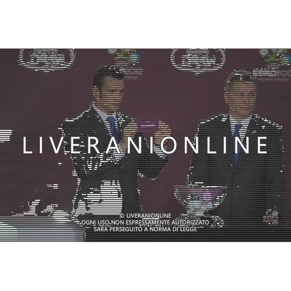 Ukrainian football star Andriy Shevchenko (L) draws Slovenia next the former Ukrainian soccer player Oleg Blokhin durnig the UEFA EURO 2012 qualifying Draw Cremony in the Congress Hall of the Palace of Culture and Science in Warsaw, Poland, 7 February 2010. /Agenzia Aldo Liverani Sas - ITALY ONLY - VARSAVIA: SORTEGGI DI QUALIFICAZIONE AGLI EUROPEI DI CALCIO UCRAINA-POLONIA 2012