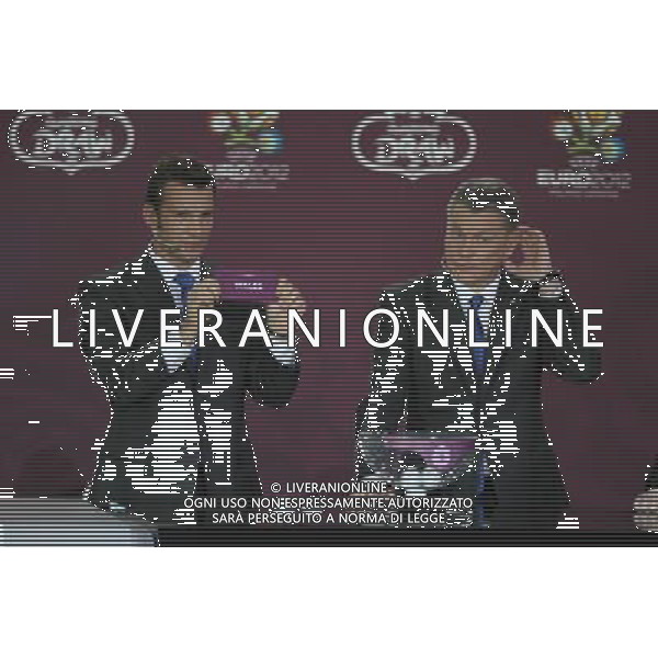 Ukrainian football star Andriy Shevchenko (L) draws Wales next the former Ukrainian soccer player Oleg Blokhin durnig the UEFA EURO 2012 qualifying Draw Cremony in the Congress Hall of the Palace of Culture and Science in Warsaw, Poland, 7 February 2010. /Agenzia Aldo Liverani Sas - ITALY ONLY - VARSAVIA: SORTEGGI DI QUALIFICAZIONE AGLI EUROPEI DI CALCIO UCRAINA-POLONIA 2012