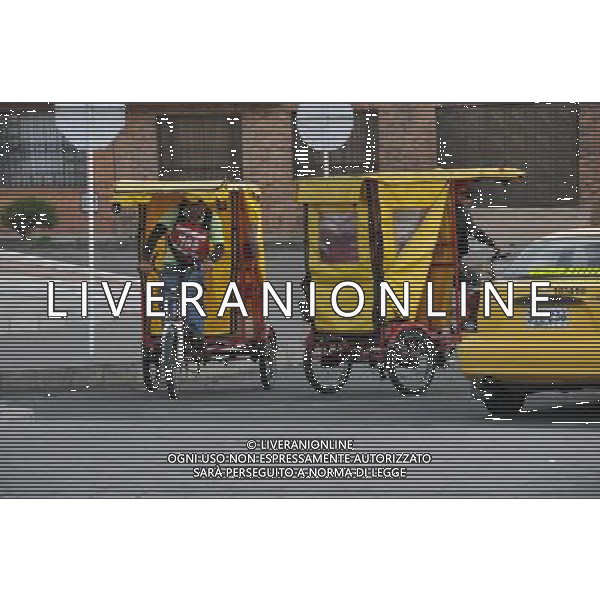 (100205) -- BOGOTA, Feb. 5, 2010 () -- Pedicabs are seen in the streets of Bogota, capital of Colombia, Feb. 4, 2010. More than 1.4 million private cars on Thursday were forbidden to run on the roads of Bogota during daytime at the Car Free Day; residents could take buses, taxis or ride bikes instead. The Bogota Car Free Day was established as an annual event since 2000. (/Huang Yongxian)(axy) /Agenzia Aldo Liverani Sas - ITALY ONLY - LE STRADE DELLA CITTA\' DI BOGOTA VUOTE E LIBERE NEL \'GIORNO SENZA AUTO\' CON IL DIVIETO DI TRANSITO PER LE AUTO PRIVATE