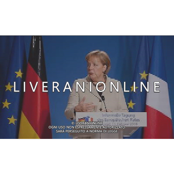 (100211) -- BRUSSELS, Feb. 11, 2010 -- German Chancellor Angela Merkel talks to the media at the end of the informal summit of the European Union (EU) in Brussels, capital of Belgium, Feb. 11, 2010. The first EU summit called by the bloc\'s first full-time President Herman Van Rompuy concluded here on Thursday afternoon, showing clear political support for debt-laden Greece. (zw) (100211) -- Brussels, feb 11, 2010 -- German Chancellor Angela Merkel and French President (Not pictured) are talking to medida at the end of the EU chief of state meeting in Bruxelles. Pool) Contact: +32 495 226 025 ) () /Agenzia Aldo Liverani Sas - ITALY ONLY - BRUXELLES: Summit della commissione europea sulla crisi economica e finanziaria dell\'europa