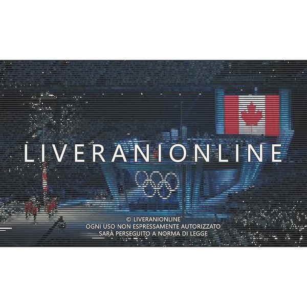 (100212) -- VANCOUVER, Feb. 12, 2010 -- The national flag of Canada is raised during the opening ceremony for the 2010 Winter Olympic Games inside the BC Place stadium in Vancouver, Canada, on Feb. 12, 2010. Wu Wei) (hy) /Agenzia Aldo Liverani Sas - ITALY ONLY - CERIMONIA D\'APERTURA DEI XXI GIOCHI OLIMPICI INVERNALI OLIMPIADI DI VANCOUVER 2010 - CANADA