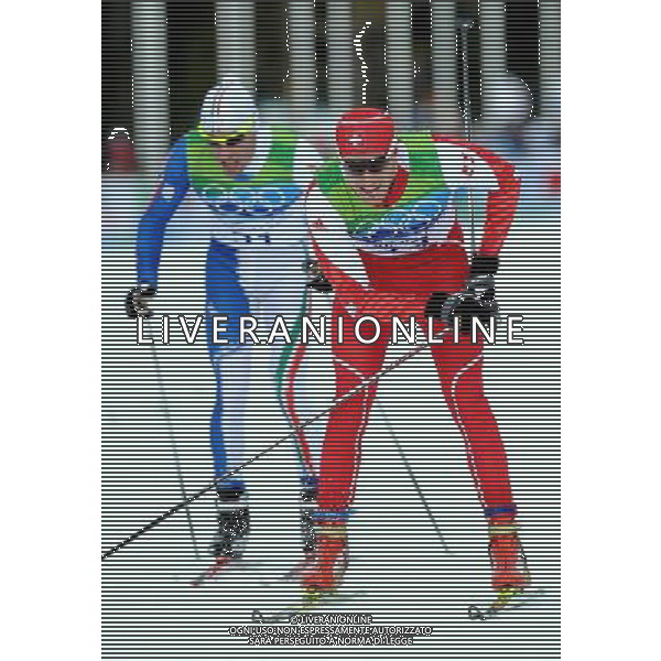 (100215) -- WHISTLER, Feb. 15, 2010 () -- Switzerland\'s Dario Cologna (R) competes during the men\'s 15km free of Cross-Country Skiing at the 2010 Winter Olympic Games in Whistler Olympic Park, Canada, Feb. 15, 2010. Dario Cologna won the gold of the event with 33:36.3. (/Chen Kai) /Agenzia Aldo Liverani Sas - ITALY ONLY - 21mi GIOCHI OLIMPICI INVERNALI OLIMPIADI DI VANCOUVER 2010 (CANADA) - SPECIALITA\' GARA MASCHILE CROSS COUNTRY (SCI DI FONDO A TECNICA LIBERA) 15 KM.