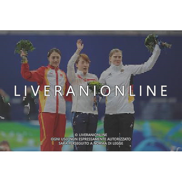 (100216) -- VANCOUVER, Feb. 16, 2010 () -- South Korea\'s Lee Sang-Hwa (C), Germay\'s Jenny Wolf (L) and China\'s Wang Beixing react on the podium during the awarding ceremony for the women\'s 500m of speed skating at the 2010 Winter Olympic Games in Richmond Olympic Oval stadium, Canada, Feb. 16, 2010. (/Wu Wei) /Agenzia Aldo Liverani Sas - ITALY ONLY - 21mi GIOCHI OLIMPICI INVERNALI OLIMPIADI DI VANCOUVER 2010 (CANADA)