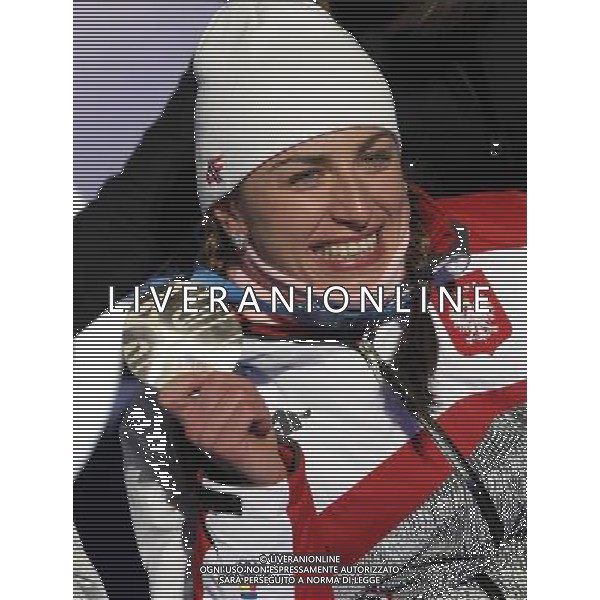 Justyna Kowalczyk of Poland celebrate on the podium during the medal ceremony of the Women\'s Individual Sprint Classic Cross Country competition at Whistler Medal Plaza during the Vancouver 2010 Olympic Games, Whistler, Canada, 17 February 2010. /Agenzia Aldo Liverani Sas - ITALY ONLY CANADA: 21mi GIOCHI OLIMPICI INVERNALI OLIMPIADI DI VANCOUVER 2010