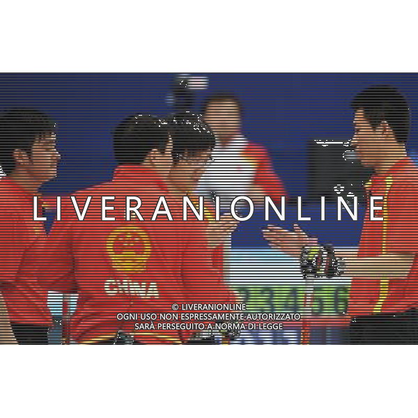(100222) -- VANCOUVER, Feb. 22, 2010 () -- China\'s Xu Xiaoming, Li Hongchen, Zang Jialiang and Liu Rui (from L to R) discuss during the men\'s curling round robin match against the United States at the 2010 Winter Olympic Games in Vancouver, Canada, Feb. 22, 2010. China won 11-5. (/Chen Kai) (hy) /Agenzia Aldo Liverani Sas - ITALY ONLY - CANADA: 21mi GIOCHI OLIMPICI INVERNALI OLIMPIADI DI VANCOUVER 2010