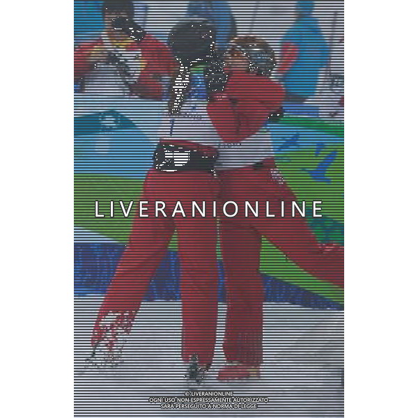 (100224) -- VANCOUVER, Feb. 24, 2010 () -- China\'s Li Nina (L) shares a hug with Guo Xinxin during the women\'s aerials final of Freestyle Skiing at the 2010 Winter Olympic Games in Cypress Mountain, Canada, Feb. 24, 2010. Li Nina won a silver medal of the event and Guo Xinxin ranked 3rd (/Qi Heng) /Agenzia Aldo Liverani Sas - ITALY ONLY - CANADA: 21mi GIOCHI OLIMPICI INVERNALI OLIMPIADI DI VANCOUVER 2010