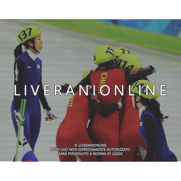 (100224) -- VANCOUVER, Feb. 24, 2010 () -- China\'s skaters celebrate while South Korea\'s Ha-Ri Cho (L) and Eun-Byul Lee looks on after the women\'s 3000m relay final of short track speed skating at the 2010 Winter Olympic Games in Vancouver, Canada, Feb. 24, 2010. China\'s team won the title of the event with a world-record-breaking time 4:06.610. (/Shen Hong) /Agenzia Aldo Liverani Sas - ITALY ONLY - CANADA: 21mi GIOCHI OLIMPICI INVERNALI OLIMPIADI DI VANCOUVER 2010