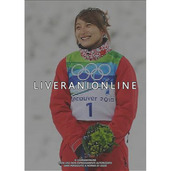 (100224) -- VANCOUVER, Feb. 24, 2010 () -- China\'s Li Nina reacts on the podium during the flower ceremony for the women\'s aerials final of Freestyle Skiing at the 2010 Winter Olympic Games in Cypress Mountain, Canada, Feb. 24, 2010. Li Nina won a silver medal of the event with 207.23 points. (/Xu Jiajun) /Agenzia Aldo Liverani Sas - ITALY ONLY - CANADA: 21mi GIOCHI OLIMPICI INVERNALI OLIMPIADI DI VANCOUVER 2010