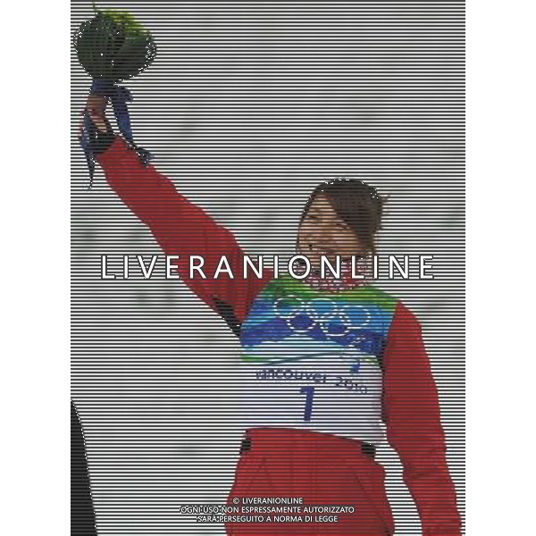 (100224) -- VANCOUVER, Feb. 24, 2010 () -- China\'s Li Nina reacts on the podium during the flower ceremony for the women\'s aerials final of Freestyle Skiing at the 2010 Winter Olympic Games in Cypress Mountain, Canada, Feb. 24, 2010. Li Nina won a silver medal of the event with 207.23 points. (/Xu Jiajun) /Agenzia Aldo Liverani Sas - ITALY ONLY - CANADA: 21mi GIOCHI OLIMPICI INVERNALI OLIMPIADI DI VANCOUVER 2010