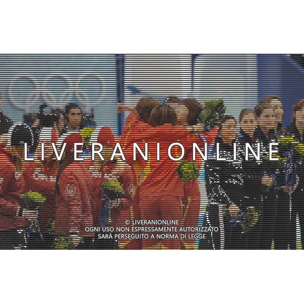 (100224) -- VANCOUVER, Feb. 24, 2010 () -- China\'s skaters (C) share a hug on the podium during the flower ceremony for the women\'s 3000m relay final of short track speed skating at the 2010 Winter Olympic Games in Vancouver, Canada, Feb. 24, 2010. China\'s team won the title of the event with a world-record-breaking time 4:06.610. South Korea\'s team was disqualified. (/Yang Lei) /Agenzia Aldo Liverani Sas - ITALY ONLY - CANADA: 21mi GIOCHI OLIMPICI INVERNALI OLIMPIADI DI VANCOUVER 2010