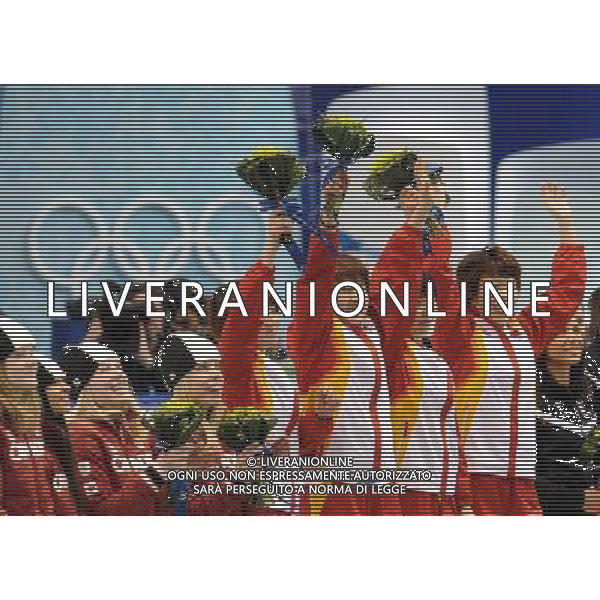 (100224) -- VANCOUVER, Feb. 24, 2010 () -- China\'s skaters react on the podium during the flower ceremony for the women\'s 3000m relay final of short track speed skating at the 2010 Winter Olympic Games in Vancouver, Canada, Feb. 24, 2010. China\'s team won the title of the event with a world-record-breaking time 4:06.610. South Korea\'s team was disqualified. (/Yang Lei) /Agenzia Aldo Liverani Sas - ITALY ONLY - CANADA: 21mi GIOCHI OLIMPICI INVERNALI OLIMPIADI DI VANCOUVER 2010