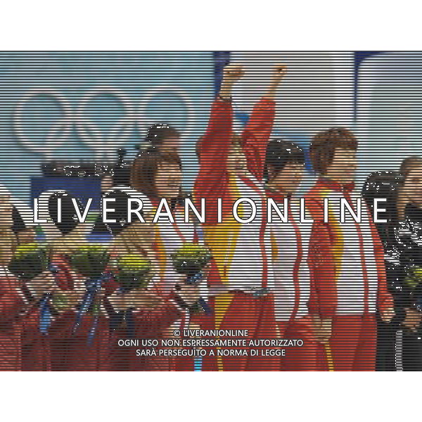 (100224) -- VANCOUVER, Feb. 24, 2010 () -- China\'s skaters react on the podium during the flower ceremony for the women\'s 3000m relay final of short track speed skating at the 2010 Winter Olympic Games in Vancouver, Canada, Feb. 24, 2010. China\'s team won the title of the event with a world-record-breaking time 4:06.610. South Korea\'s team was disqualified. (/Yang Lei) /Agenzia Aldo Liverani Sas - ITALY ONLY - CANADA: 21mi GIOCHI OLIMPICI INVERNALI OLIMPIADI DI VANCOUVER 2010