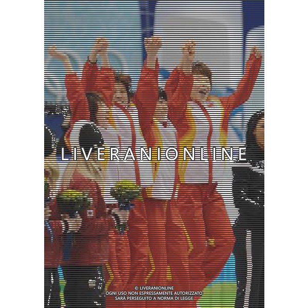 (100224) -- VANCOUVER, Feb. 24, 2010 () -- China\'s Zhou Yang, Zhang Hui, Wang Meng and Sun Linlin (R-L) steps onto the podium after the flower ceremony for the women\'s 3000m relay final of short track speed skating at the 2010 Winter Olympic Games in Vancouver, Canada, Feb. 24, 2010. China\'s team won the title of the event with a world-record-breaking time 4:06.610. South Korea\'s team was disqualified. (/Yang Lei) /Agenzia Aldo Liverani Sas - ITALY ONLY - CANADA: 21mi GIOCHI OLIMPICI INVERNALI OLIMPIADI DI VANCOUVER 2010
