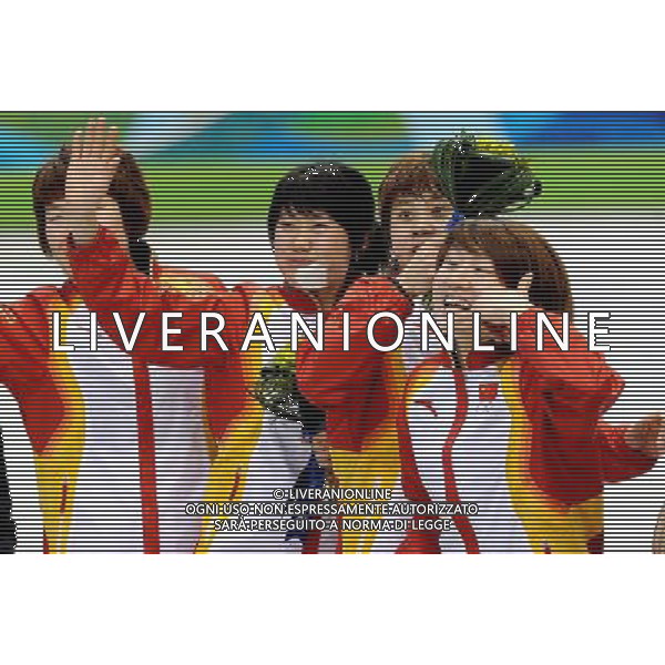 (100224) -- VANCOUVER, Feb. 24, 2010 () -- China\'s Zhou Yang, Zhang Hui, Wang Meng and Sun Linlin react on the podium during the flower ceremony for the women\'s 3000m relay final of short track speed skating at the 2010 Winter Olympic Games in Vancouver, Canada, Feb. 24, 2010. China\'s team won the title of the event with a world-record-breaking time 4:06.610. (/Chen Kai) /Agenzia Aldo Liverani Sas - ITALY ONLY - CANADA: 21mi GIOCHI OLIMPICI INVERNALI OLIMPIADI DI VANCOUVER 2010