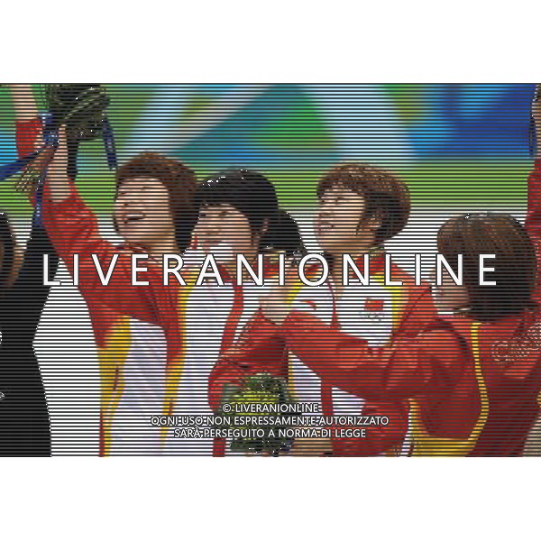 (100224) -- VANCOUVER, Feb. 24, 2010 () -- China\'s Zhou Yang, Zhang Hui, Wang Meng and Sun Linlin (L-R) react on the podium during the flower ceremony for the women\'s 3000m relay final of short track speed skating at the 2010 Winter Olympic Games in Vancouver, Canada, Feb. 24, 2010. China\'s team won the title of the event with a world-record-breaking time 4:06.610. (/Chen Kai) /Agenzia Aldo Liverani Sas - ITALY ONLY - CANADA: 21mi GIOCHI OLIMPICI INVERNALI OLIMPIADI DI VANCOUVER 2010
