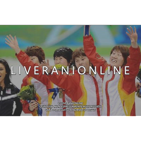 (100224) -- VANCOUVER, Feb. 24, 2010 () -- China\'s Zhou Yang, Zhang Hui, Wang Meng and Sun Linlin (L-R) react on the podium during the flower ceremony for the women\'s 3000m relay final of short track speed skating at the 2010 Winter Olympic Games in Vancouver, Canada, Feb. 24, 2010. China\'s team won the title of the event with a world-record-breaking time 4:06.610. (/Chen Kai) /Agenzia Aldo Liverani Sas - ITALY ONLY - CANADA: 21mi GIOCHI OLIMPICI INVERNALI OLIMPIADI DI VANCOUVER 2010