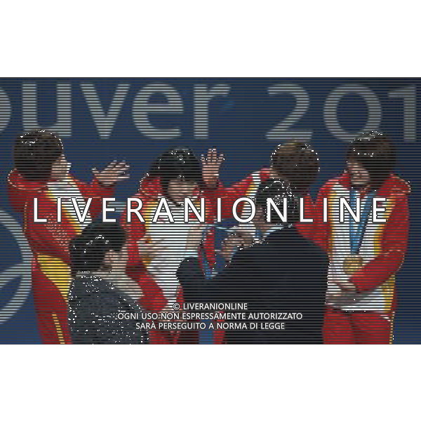 (100225) -- VANCOUVER, Feb. 25, 2010 () -- China\'s Zhou Yang, Zhang Hui, Wang Meng and Sun Linlin (L-R) react on the podium during the awarding ceremony for the women\'s 3000m relay of short track speed skating at the 2010 Winter Olympic Games in Vancouver, Canada, Feb. 25, 2010. China won the gold medal. (/Han Yan) /Agenzia Aldo Liverani Sas - ITALY ONLY - CANADA: 21mi GIOCHI OLIMPICI INVERNALI OLIMPIADI DI VANCOUVER 2010