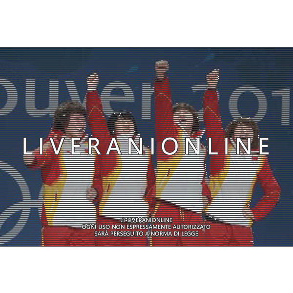 (100225) -- VANCOUVER, Feb. 25, 2010 () -- China\'s Zhou Yang, Zhang Hui, Wang Meng and Sun Linlin (L-R) react on the podium during the awarding ceremony for the women\'s 3000m relay of short track speed skating at the 2010 Winter Olympic Games in Vancouver, Canada, Feb. 25, 2010. China won the gold medal. (/Han Yan) /Agenzia Aldo Liverani Sas - ITALY ONLY - CANADA: 21mi GIOCHI OLIMPICI INVERNALI OLIMPIADI DI VANCOUVER 2010