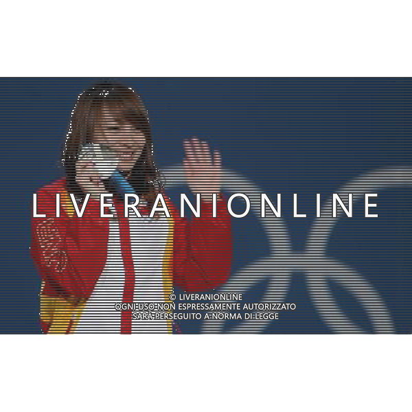 (100225) -- VANCOUVER, Feb. 25, 2010 () -- China\'s Li Nina reacts on the podium during the awarding ceremony for the women\'s aerials final of freestyle skiing at the 2010 Winter Olympic Games in Vancouver, Canada, Feb. 25, 2010. Guo Xinxin won the bronze medal. (/Han Yan) /Agenzia Aldo Liverani Sas - ITALY ONLY - CANADA: 21mi GIOCHI OLIMPICI INVERNALI OLIMPIADI DI VANCOUVER 2010