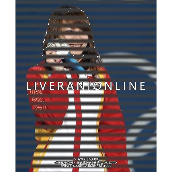 (100225) -- VANCOUVER, Feb. 25, 2010 () -- China\'s Li Nina reacts on the podium during the awarding ceremony for the women\'s aerials final of freestyle skiing at the 2010 Winter Olympic Games in Vancouver, Canada, Feb. 25, 2010. Guo Xinxin won the bronze medal. (/Han Yan) /Agenzia Aldo Liverani Sas - ITALY ONLY - CANADA: 21mi GIOCHI OLIMPICI INVERNALI OLIMPIADI DI VANCOUVER 2010
