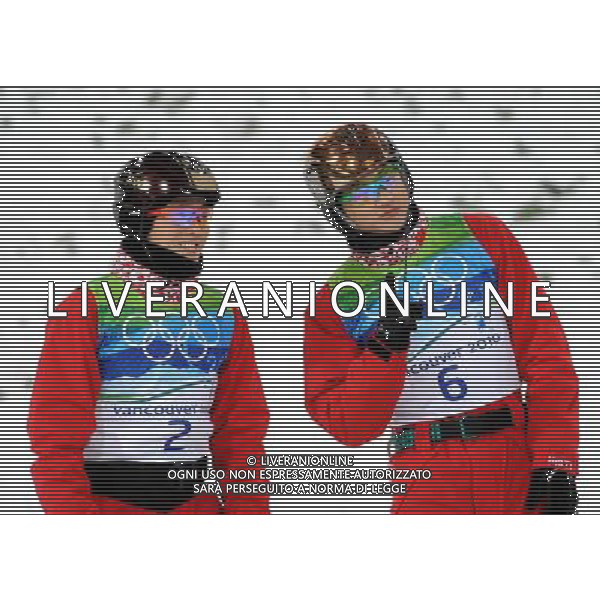 (100225) -- VANCOUVER, Feb. 25, 2010 () -- China\'s Liu Zhongqing (R) and Qi Guangpu react prior to the men\'s aerials final of Freestyle Skiing at the 2010 Winter Olympic Games in Cypress Mountain, Canada, Feb. 25, 2010. Liu Zhongqing won a bronze medal of the event with 242.53 points. (/Shen Hong) /Agenzia Aldo Liverani Sas - ITALY ONLY - CANADA: 21mi GIOCHI OLIMPICI INVERNALI OLIMPIADI DI VANCOUVER 2010