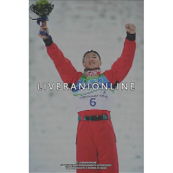 (100225) -- VANCOUVER, Feb. 25, 2010 () -- China\'s Liu Zhongqi celebrates on the podium during the flower ceremony for the men\'s aerials final of Freestyle Skiing at the 2010 Winter Olympic Games in Cypress Mountain, Canada, Feb. 25, 2010. Liu Zhongqi won a bronze medal of the event with 242.53 points. (/Xu Jiajun) /Agenzia Aldo Liverani Sas - ITALY ONLY - CANADA: 21mi GIOCHI OLIMPICI INVERNALI OLIMPIADI DI VANCOUVER 2010