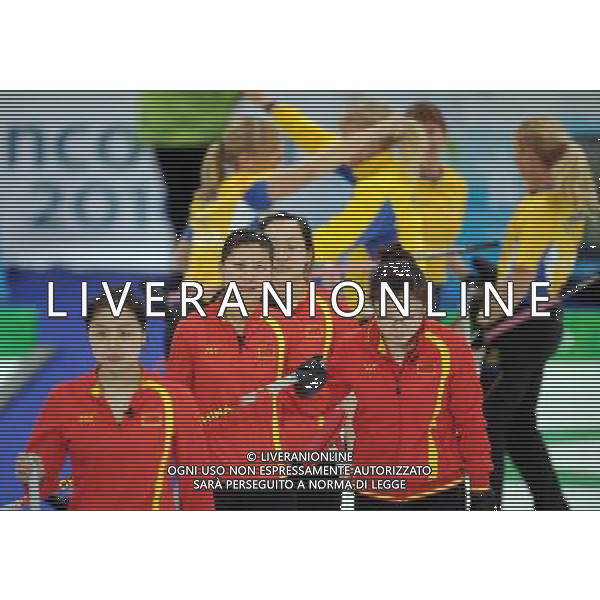 (100225) -- VANCOUVER, Feb. 25, 2010 () -- China\'s Wang Bingyu, Zhou Yan, Liu Yin and Yue Qingshuang (from R to L) react after the women\'s curling semifinal against Sweden at the 2010 Winter Olympic Games in Vancouver, Canada, Feb. 25, 2010. China lost 4-9 and was disqualified for the final. (/Xu Jiajun) (hy) /Agenzia Aldo Liverani Sas - ITALY ONLY - CANADA: 21mi GIOCHI OLIMPICI INVERNALI OLIMPIADI DI VANCOUVER 2010
