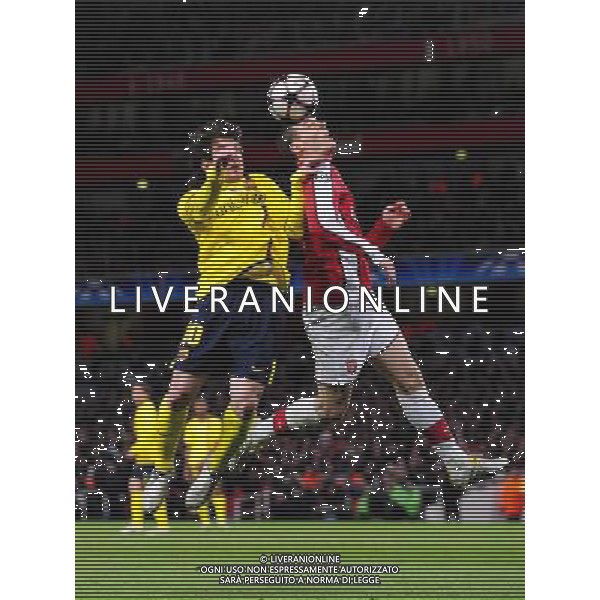 ARSENAL - BARCELLONA QUARTI DI FINALE ANDATA CHAMPIONS LEAGUE (100401) -- LONDON, April 1, 2010 () -- Barcelona\'s Lionel Messi (L) and Arsenal\'s Thomas Vermaelen head for the ball during their Champions League quarter-finals first leg soccer match at Emirates stadium in London, March 31, 2010. Barcelona drew 2-2 with Arsenal.(/Zeng Yi)(dx) /Agenzia Aldo Liverani Sas - ITALY ONLY