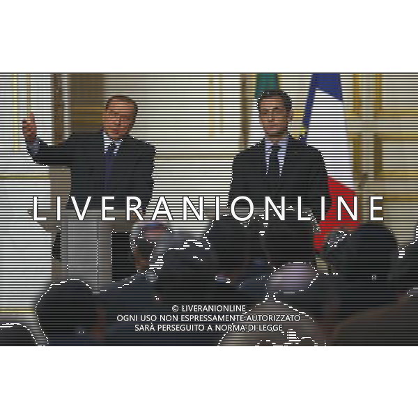 (100410) -- PARIS, April 10, 2010 -- Italian Prime Minister Silvio Berlusconi (L) and French President Nicolas Sarkozy attend the press conference of France-Italy Summit at the Elysee Palace, Paris, capital of France, April 9, 2010. The two leaders presided the signing of 20 agreements, letter of intents and joint declarations on Friday. Zhang Yuwei) (msq) /Agenzia Aldo Liverani Sas - ITALY ONLY -