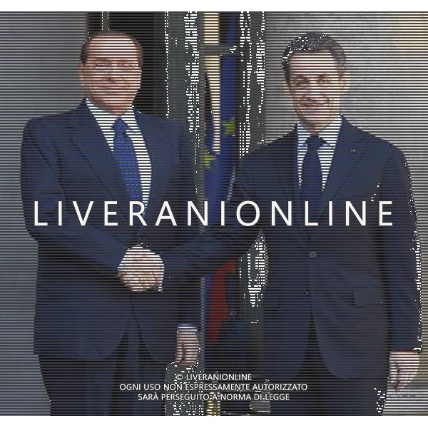 (100410) -- PARIS, April 10, 2010 -- French President Nicolas Sarkozy (R) receives Italian Prime Minister Silvio Berlusconi before the France-Italy Summit at the Elysee Palace, Paris, capital of France, April 9, 2010. The two leaders presided the signing of 20 agreements, letter of intents and joint declarations on Friday. Zhang Yuwei) (msq) /Agenzia Aldo Liverani Sas - ITALY ONLY -