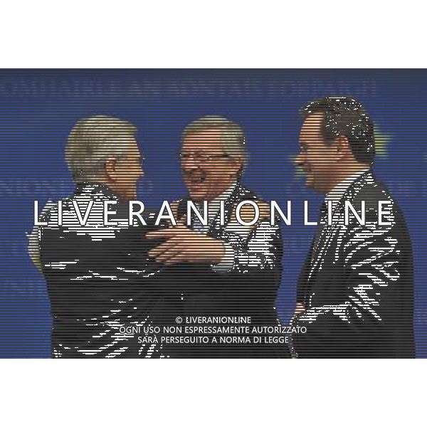 (100502) -- BRUSSELS, May 2, 2010 -- President of Eurogroup and Prime Minister of Luxembourg Jean-Claude Juncker (C) hugs President of European Central Bank Jean-Claude Trichet (L) as Greek Finance Minister George Papaconstantinou looks on at a press conference after Eurogroup finance ministers meeting in Brussels, capital of Belgium on May 2, 2010. Eurozone finance ministers agreed on Sunday to activate the aid package for Greece, offering along with the International Monetary Fund (IMF) 110 billion euros to the debt-laden country in the next three years. Wu Wei) (zw) ©Photoshot/Agenzia Aldo Liverani Sas - ITALY ONLY - BRUXELLES: MEETING STRAORDINARIO EUROPEO DEI MINISTRI DELLE FINANZE DELL\'EUROGRUPPO SULLA CRISI FINANZIARIA E GLI AIUTI ALLA GRECIA