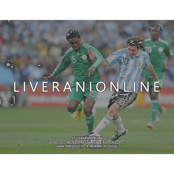 (100612) -- JOHANNESBURG, June 12, 2010 () -- Lionel Messi of Argentina (R, front) vies with Lukman Haruna of Nigeria during their group B first round match at the 2010 FIFA World Cup at Ellis Park stadium in Johannesburg, South Africa, on June 12, 2010. (/Wang Yuguo) (xm) ©Photoshot/Agenzia Aldo Liverani Sas - ITALY ONLY - ARGENTINA- USA FIFA WORLD CUP CAMPIONATI MONDIALI SUD AFRICA 2010