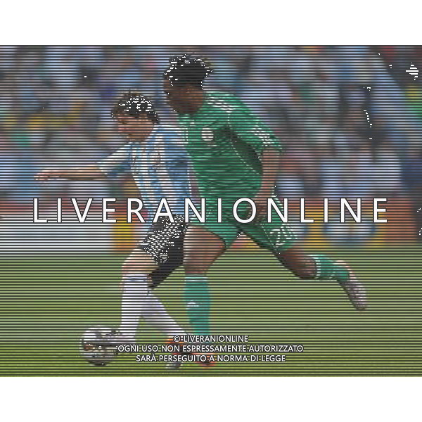 (100612) -- JOHANNESBURG, June 12, 2010 () -- Lionel Messi of Argentina(L) runs with the ball during a group B first round match against Nigeria at the 2010 FIFA World Cup at Ellis Park stadium in Johannesburg, South Africa, on June 12, 2010. (/Wang Yuguo) (xm) ©Photoshot/Agenzia Aldo Liverani Sas - ITALY ONLY - ARGENTINA- USA FIFA WORLD CUP CAMPIONATI MONDIALI SUD AFRICA 2010