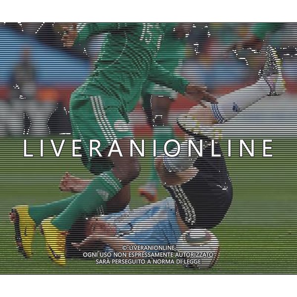 (100612) -- JOHANNESBURG, June 12, 2010 () -- Lionel Messi of Argentina (below) falls on the ground during a group B first round match against Nigeria at the 2010 FIFA World Cup at Ellis Park stadium in Johannesburg, South Africa, on June 12, 2010. Argentina won 1-0. (/Wang Yuguo) (xm) ©Photoshot/Agenzia Aldo Liverani Sas - ITALY ONLY - ARGENTINA- USA FIFA WORLD CUP CAMPIONATI MONDIALI SUD AFRICA 2010