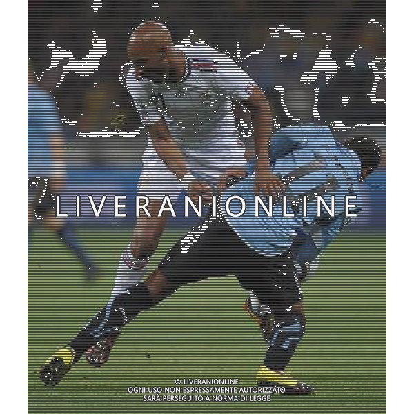 (100612) -- CAPE TOWN, June 12, 2010 () -- Nicolas Anelka (L) of France vies with Alvaro Pereira of Uruguay during a Group A match of the 2010 FIFA World Cup at Green Point stadium in Cape Town, South Africa, on June 11, 2010. The match ended with a 0-0 draw. (/Yang Lei) ©Photoshot/Agenzia Aldo Liverani Sas - ITALY ONLY - FRANCIA - URUGUAY FIFA WORLD CUP CAMPIONATI MONDIALI SUD AFRICA 2010