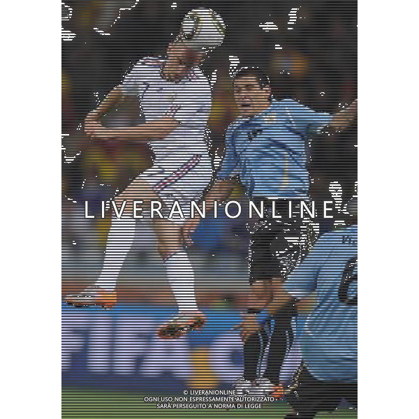 (100612) -- CAPE TOWN, June 12, 2010 () -- Franck Ribery (L) of France heads the ball during a Group A match of the 2010 FIFA World Cup against Uruguay at Green Point stadium in Cape Town, South Africa, on June 11, 2010. The match ended with a 0-0 draw. (/Yang Lei) (kh) ©Photoshot/Agenzia Aldo Liverani Sas - ITALY ONLY - FRANCIA - URUGUAY FIFA WORLD CUP CAMPIONATI MONDIALI SUD AFRICA 2010