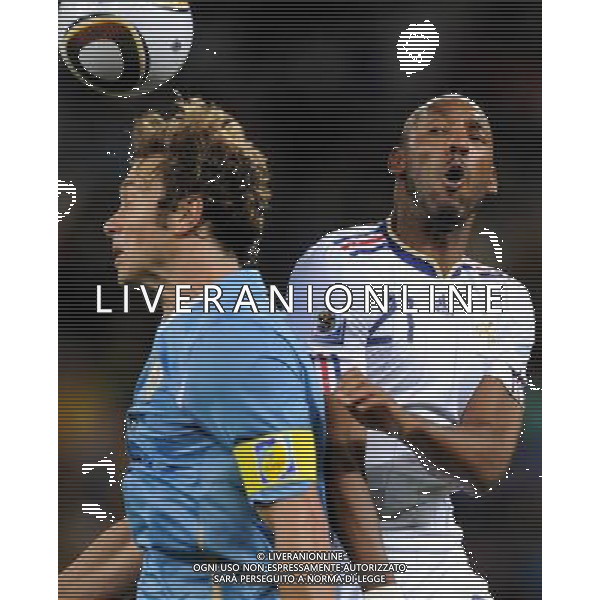 (100612) -- CAPE TOWN, June 12, 2010 () -- Nicolas Anelka (R) of France vies with Diego Lugano of Uruguay during a Group A match of the 2010 FIFA World Cup at the Green Point stadium in Cape Town, South Africa, on June 11, 2010. (/Yang Lei) (kh) ©Photoshot/Agenzia Aldo Liverani Sas - ITALY ONLY - FRANCIA - URUGUAY FIFA WORLD CUP CAMPIONATI MONDIALI SUD AFRICA 2010